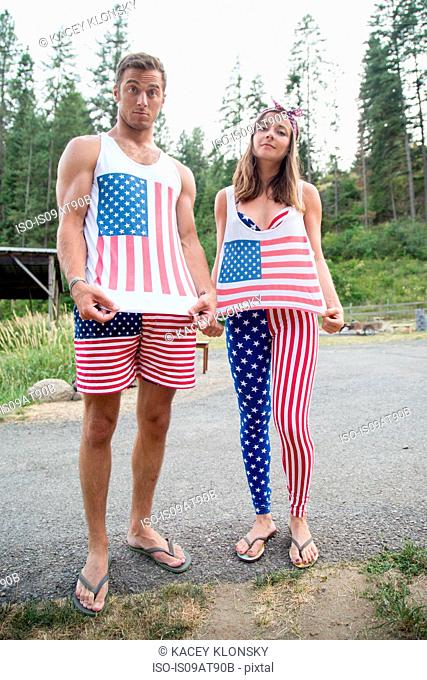 Portrait of couple showing off American flag costume celebrating Independence Day, USA