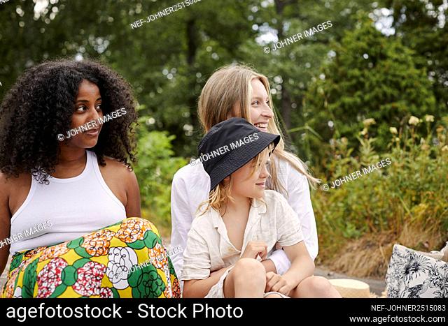 Two women and girl having fun together