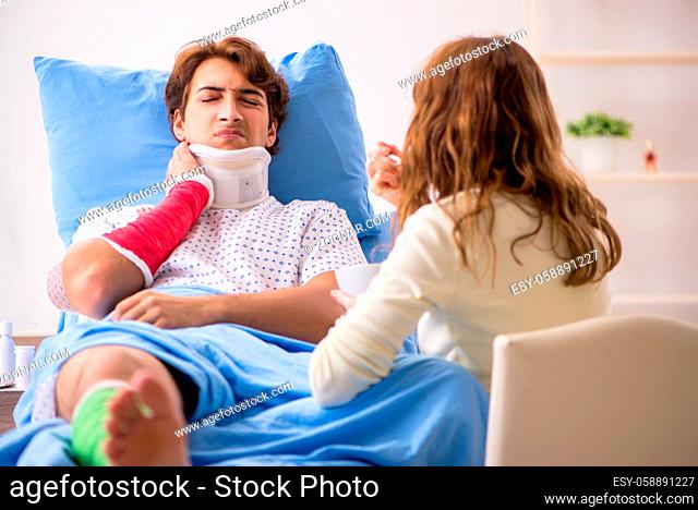 Loving wife looking after injured husband in hospital