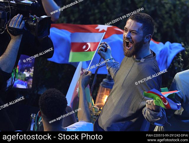 15 May 2022, Italy, Turin: Nadir Rustamli from Azerbaijan cheers during the awarding of the scoring points after the final of the Eurovision Song Contest (ESC)