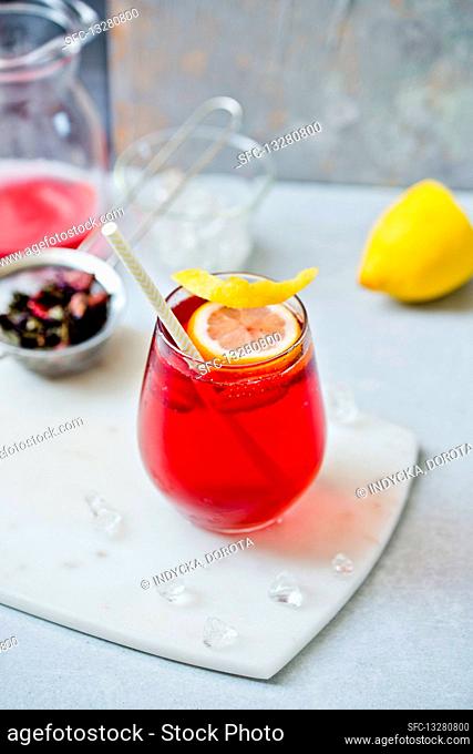 Homemade iced tea with a lemon wedge in a glass