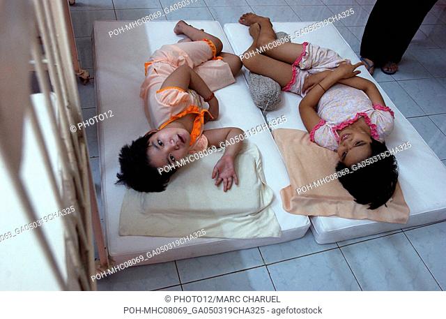Ill children in bed 2005