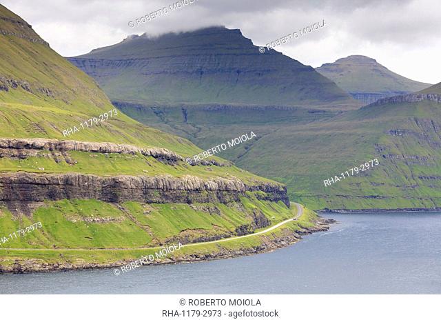 Road along mountain towards Funningur, Eysturoy Island, Faroe Islands, Denmark, Europe