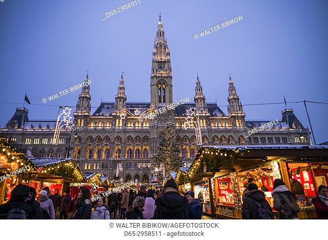 Austria, Vienna, Rathausplatz Christmas Market by Town Hall, evening