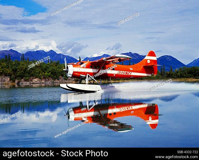 Lake Clark Air Service's de Havilland DHC3 Otter landing in the channel of Hardenburg Bay, Port Alsworth, Lake Clark, Alaska