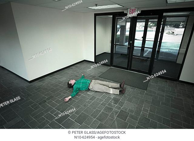 Man posing in the lobby of an office building