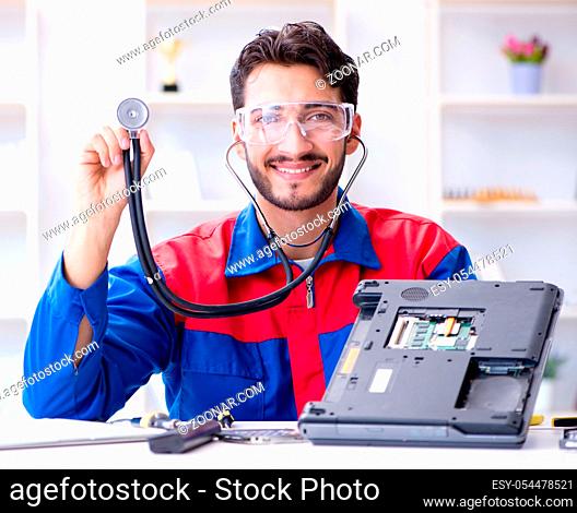 Repairman working in technical support fixing computer laptop troubleshooting