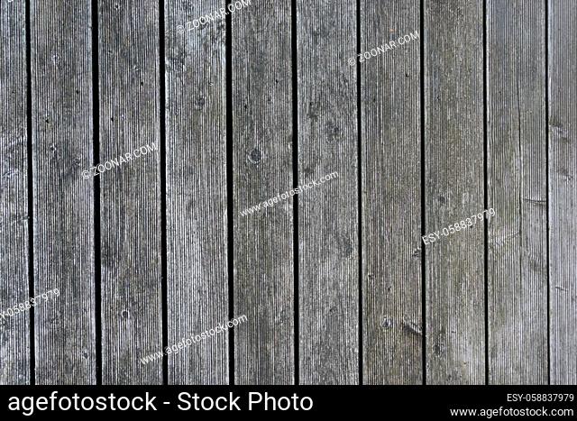 Natural brown and gray barn wood wall. Wall texture background pattern. Wood planks, boards are old with a beautiful rustic look, style