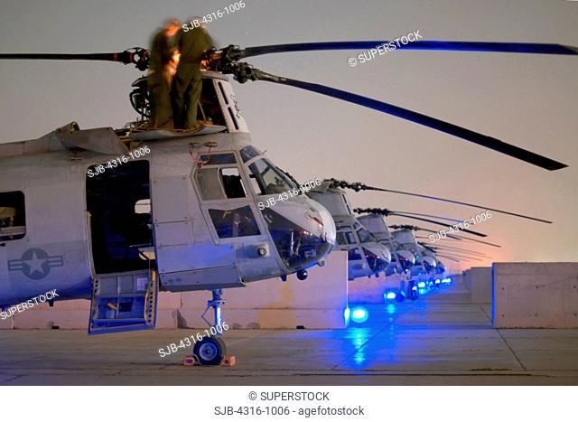 Nighttime View of US Marine Corps CH-46 Sea Knights at Al Taqaddum Air Base in Iraq's Al Anbar Province