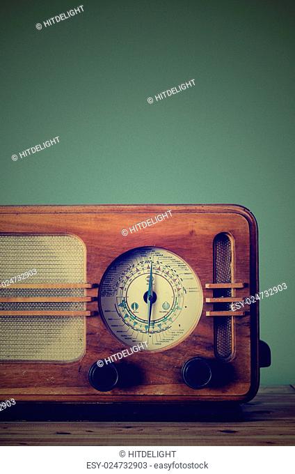 Antique radio on retro background
