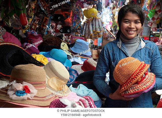 Hat seller at a Cambodian country market in Ratanakiri province