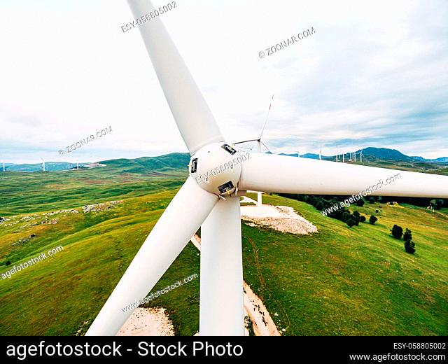 Close-up of the wind turbine blades in front. High quality photo