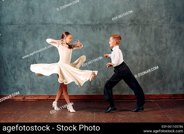 Young dancers boy and girl dancing in ballroom dance Samba