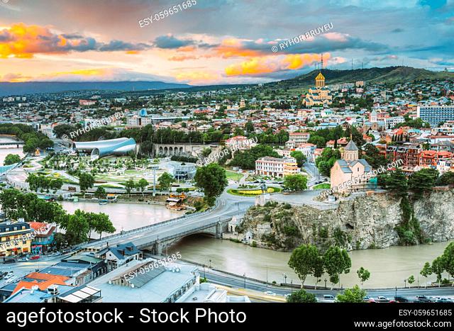 Evening View Of Tbilisi At Colorful Sunset, Georgia. Summer Cityscape. On Photograph Visible A New Concert Hall, Avlabar Residence - Presidential Administration...