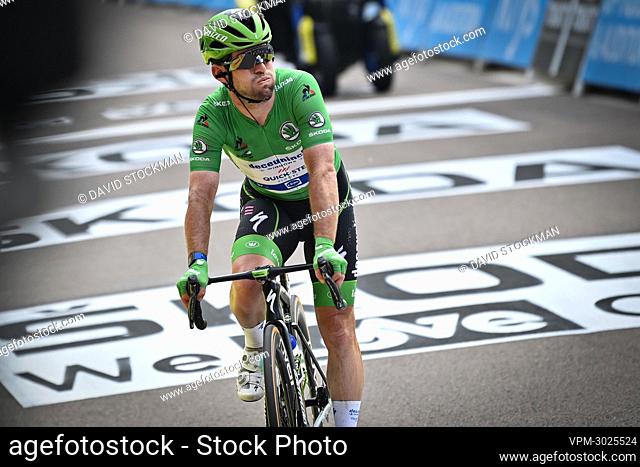 British Mark Cavendish of Deceuninck - Quick-Step wearing the green jersey crosses the finish line of the seventh stage of the 108th edition of the Tour de...