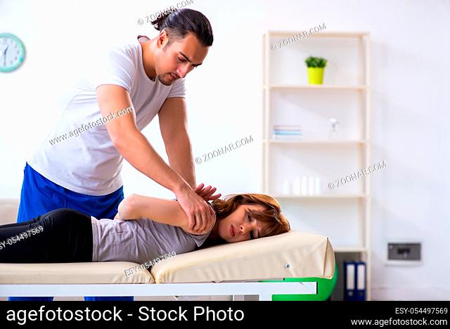 The young woman visiting male doctor physiotherapist