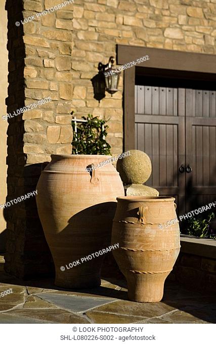 Terra cotta pots outside tuscan home