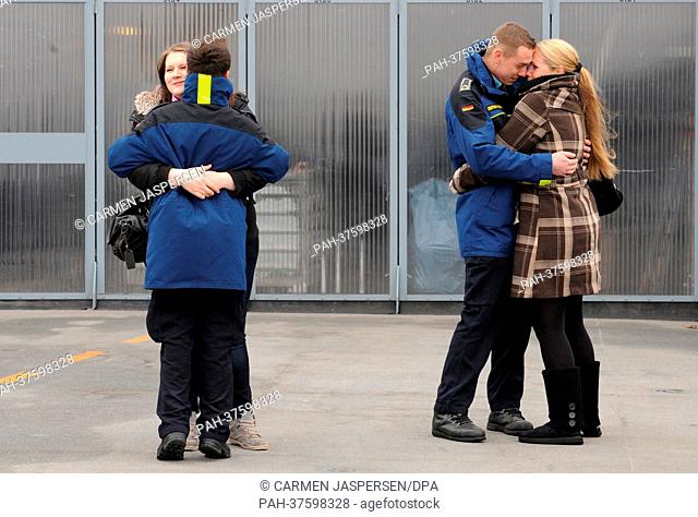Two couples say good bye in the naval base in Wilhelmshaven, Germany, 25 Feruary 2013. The frigate 'Bremen' is on her last voyage after 30 years of naval...