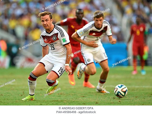 Mario Goetze (L) of Germany in action during the FIFA World Cup 2014 group G preliminary round match between Germany and Ghana at the Estadio Castelao Stadium...