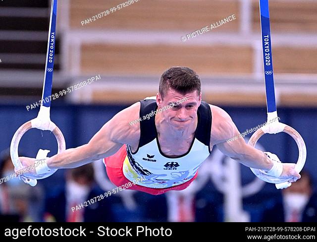 28 July 2021, Japan, Tokio: Gymnastics: Olympia, all-around, men, final at Ariake Gymnastics Centre. Lukas Dauser from Germany performs on the rings