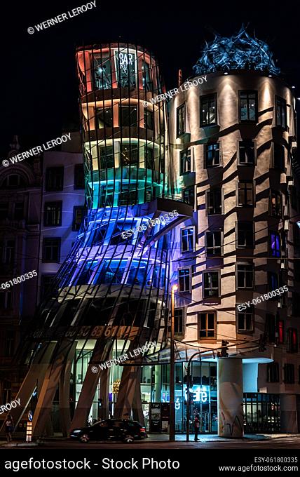 Prague - Czech Republic The facade of the dancing house by night with colorful light decoration