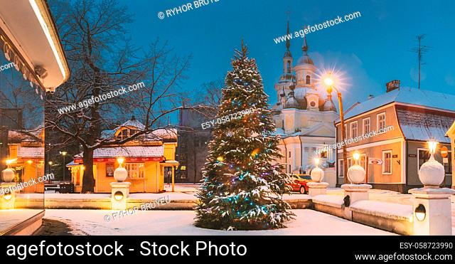 Parnu, Estonia - December 15, 2017: Christmas Tree In Holiday New Year Festive Illumination And St. Katherine Orthodox Church. Panorama