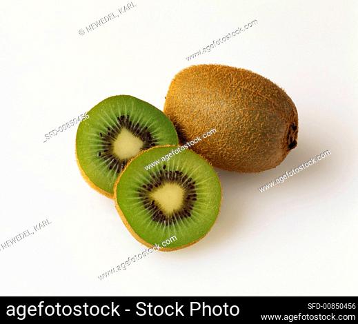 Two half and one whole kiwi fruits