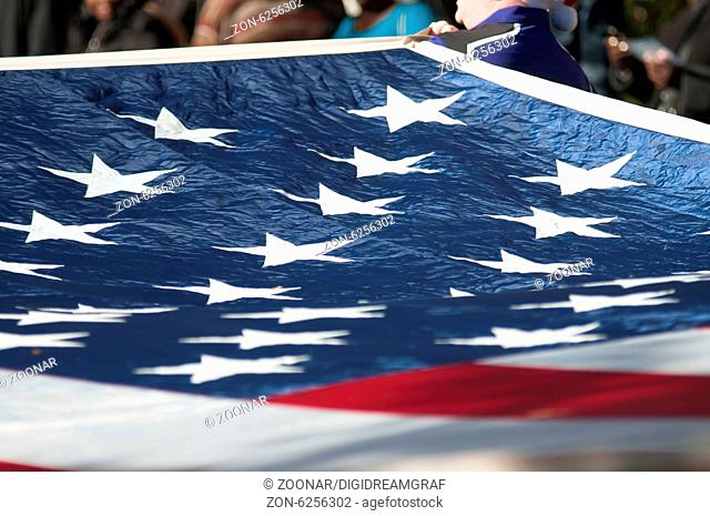 american flag carried at the parade