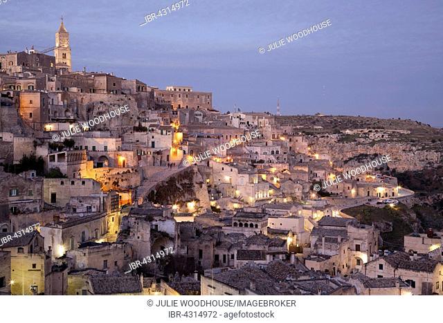 View across the town from the viewpoint at Piazzetta Pascoli, dusk, Sassi di Matera, cave dwellings, Matera, Basilicata, Italy