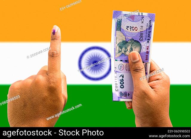 Hand holding money and vote a concept of political corruption the purchase of votes in elections on isolated background