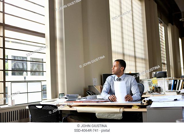 Businessman at desk in office