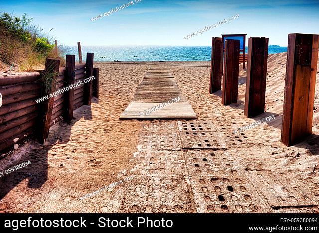 Entrance walkway to the beach at Baltic Sea on Hel Peninsula in Poland, reinforced with wooden beams and concrete plates