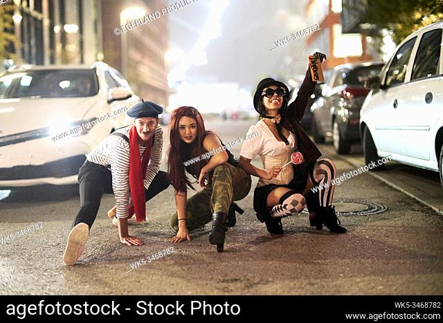 Group of young people fooling around on Munich streets. Germany
