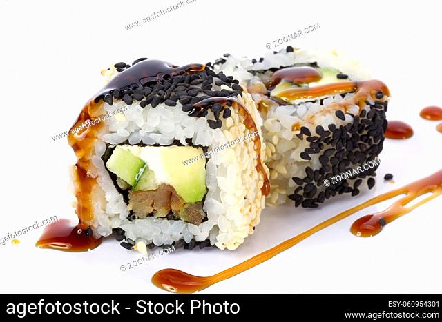 Sushi rolls japanese food isolated on white background.California Sushi roll with tuna, vegetables and unagi sauce closeup