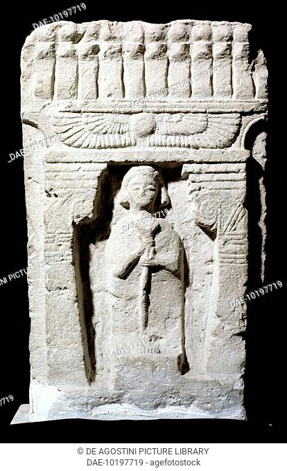 Stele with the human figure facing forward and holding a lotus flower, from Sulcis, Sardinia, Italy. Phoenician civilisation
