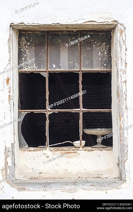 white wall, old broken factory window, broken glass, metal ladle, glass cake stand  (CTK Photo/Libor Sojka)
