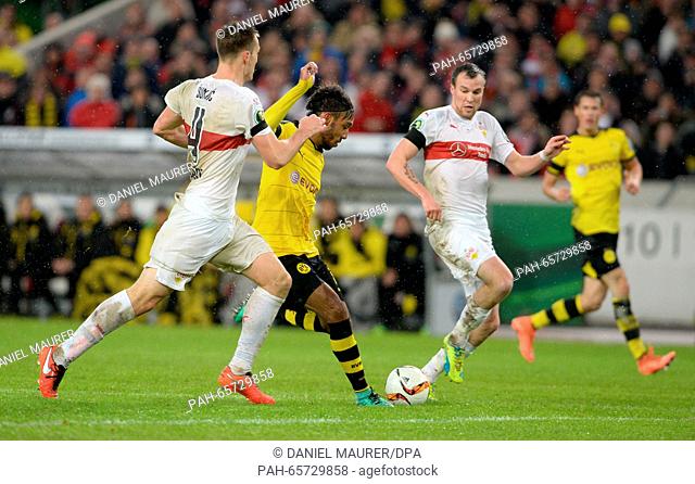 Dortmund's goal-scorer Pierre-Emerick Aubameyang (C) scores the 2-1 goal against Stuttgart's Toni Sunjic (L) and Kevin Grosskreutz during the DFB Cup soccer...