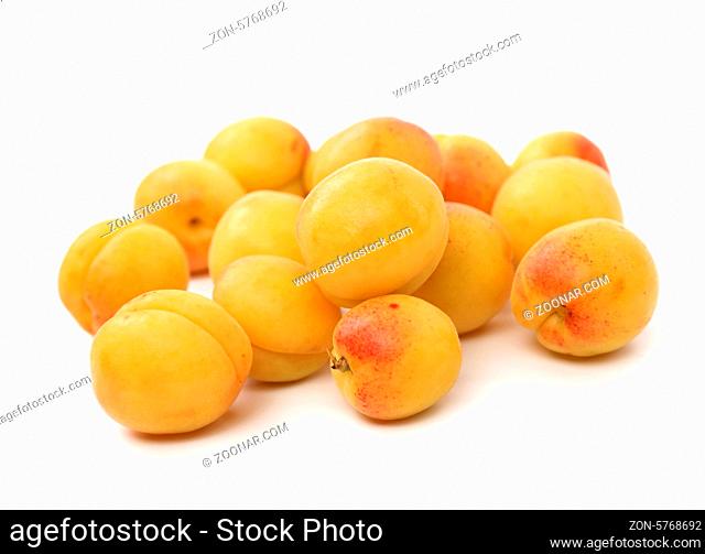 Group of ripe apricots isolated on white background
