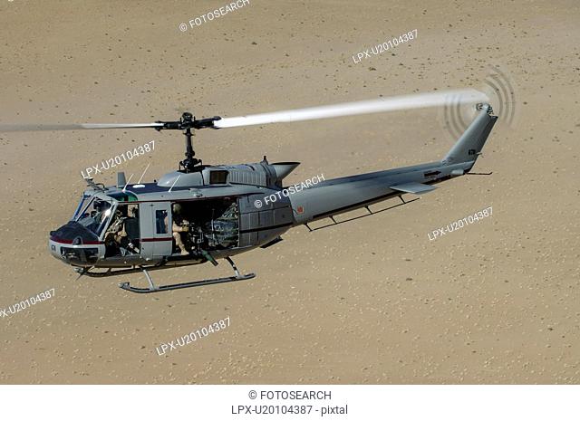 Bell Huey II in flight over the Registan Desert