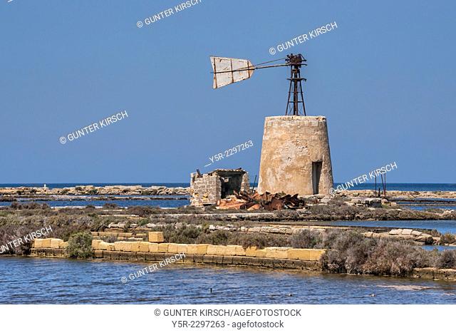 A broken windmill in a saltwork near Marsala. From Marsala to Trapani leads the Via del Sale, the salt road. The windmills serve as pumps for the brine