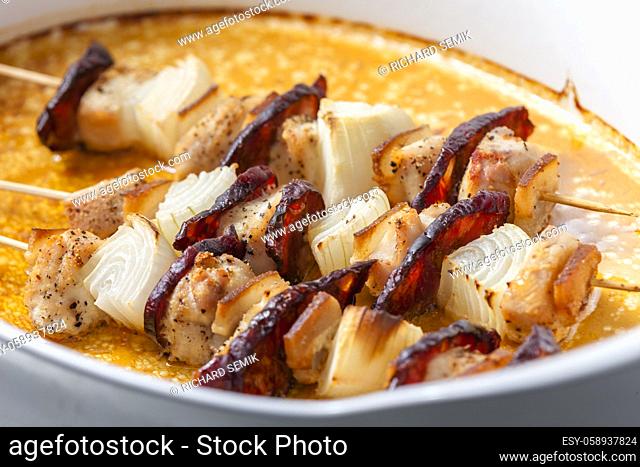 skewers with meat, bacon and onion