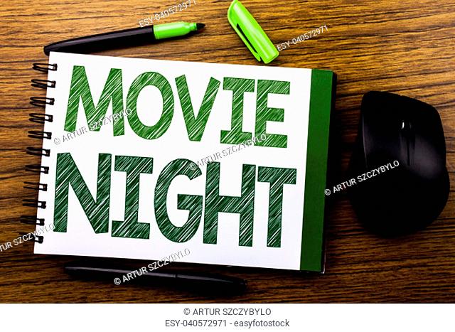 Handwriting Announcement text showing Movie Night. Business concept for Wathing Movies written on notebook book note paper on wooden background