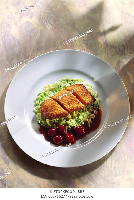 Crispy duck breast on pointed cabbage with glace cherries