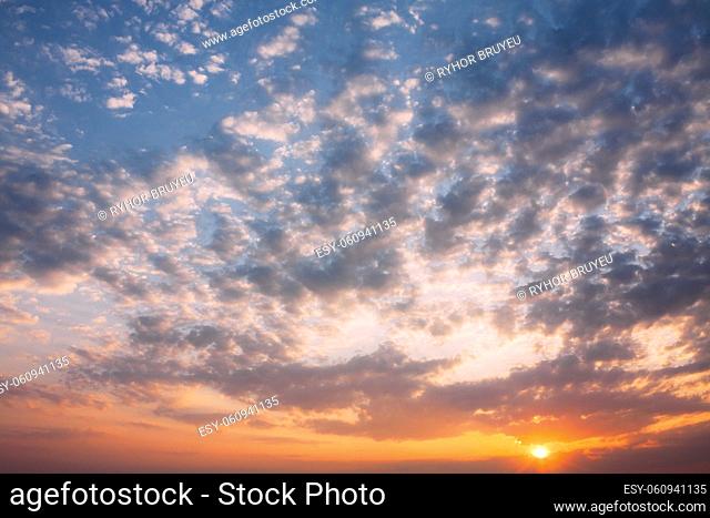 Sun Sunshine During Sunset Sunrise In Sky Background. Natural Bright Dramatic Sky In Sunset Dawn Sunrise. Yellow And Pink Colors