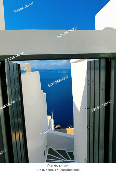 View to the sea from stairs in Oia the most beautiful village of Santorini island in Greece
