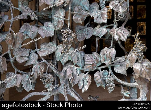 wrought-iron grille showing the vines, Pecs, HUngary