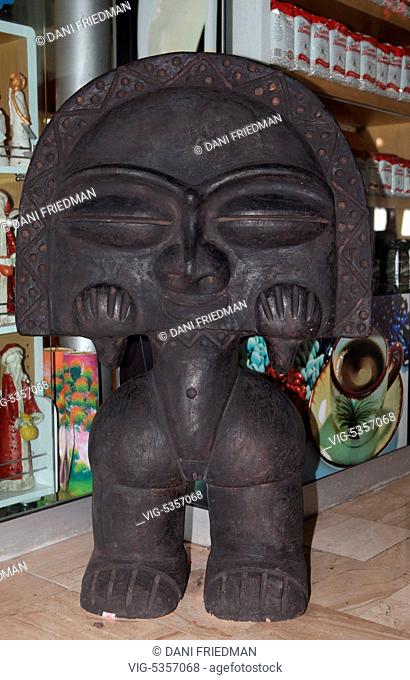 Large terracotta figure of Luna, the Moon Goddess from the Taino Indian mythology in front of a small shop in Punta Cana in the Dominican Republic