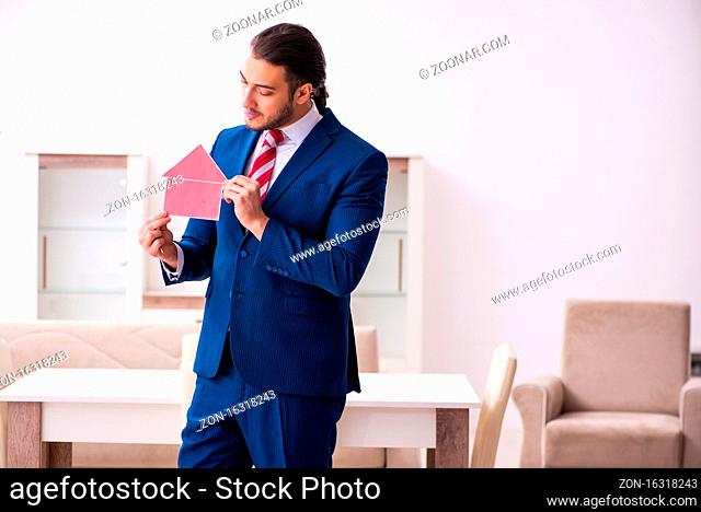 Young male realtor working indoors