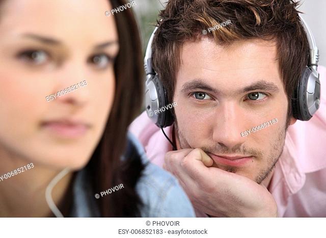 man with headphones beholding his belle