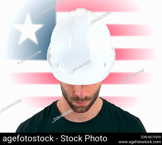 Isolated engineer with flag on background - Liberia
